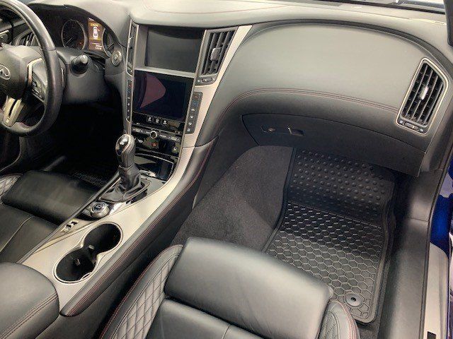 The interior of a car with black seats and a steering wheel