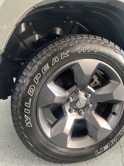 A close up of a tire on a ram truck