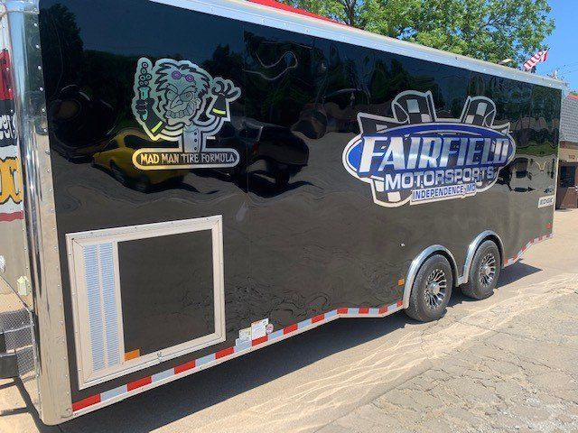 A black trailer with the words fairfield motorsports written on it