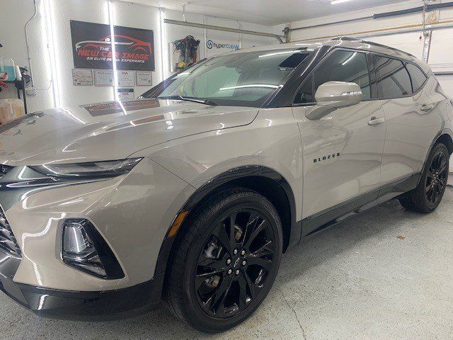 A chevrolet blazer is parked in a garage.