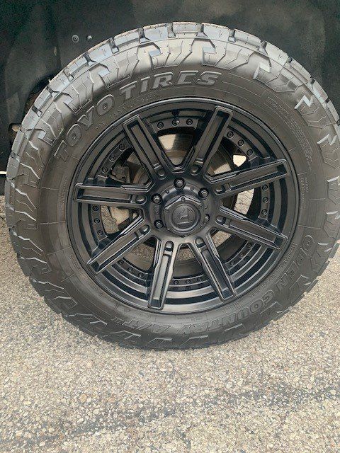 A close up of a tire and wheel on a truck.