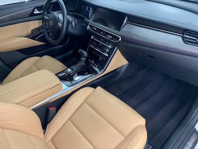 The interior of a car with tan leather seats