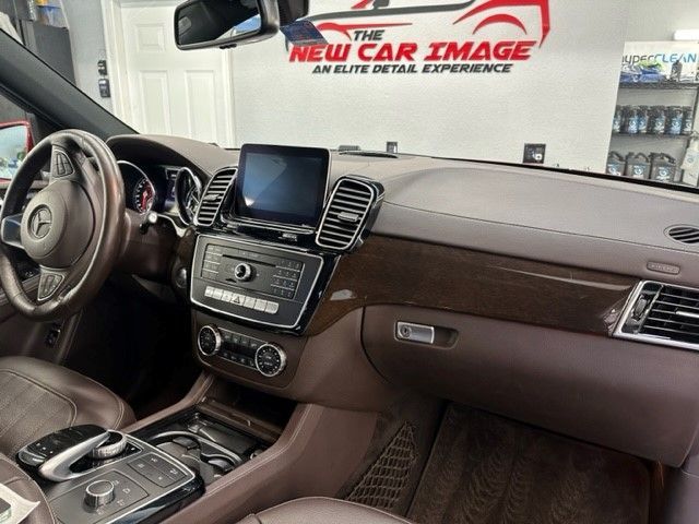 The interior of a car with a new car image logo in the background