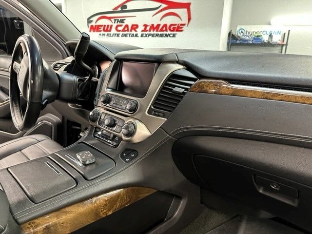 The interior of a car with the new car image logo in the background