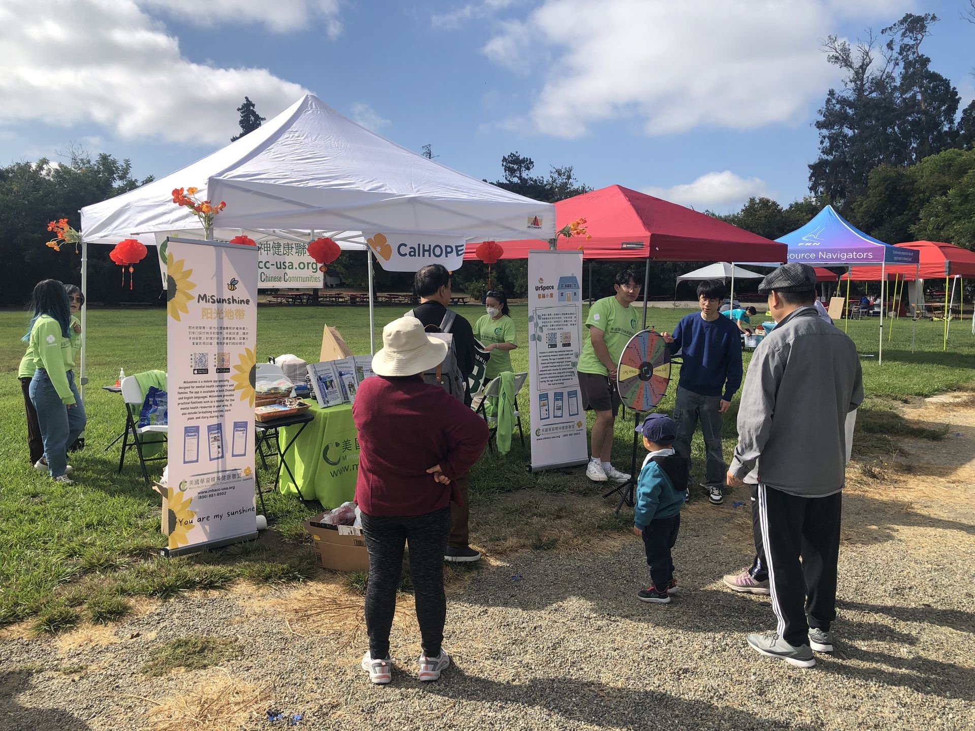 A family approaches the booth