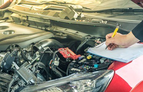 Auto Diagnostics — Mechanic Inspecting The Car Engine in Agawam, MA