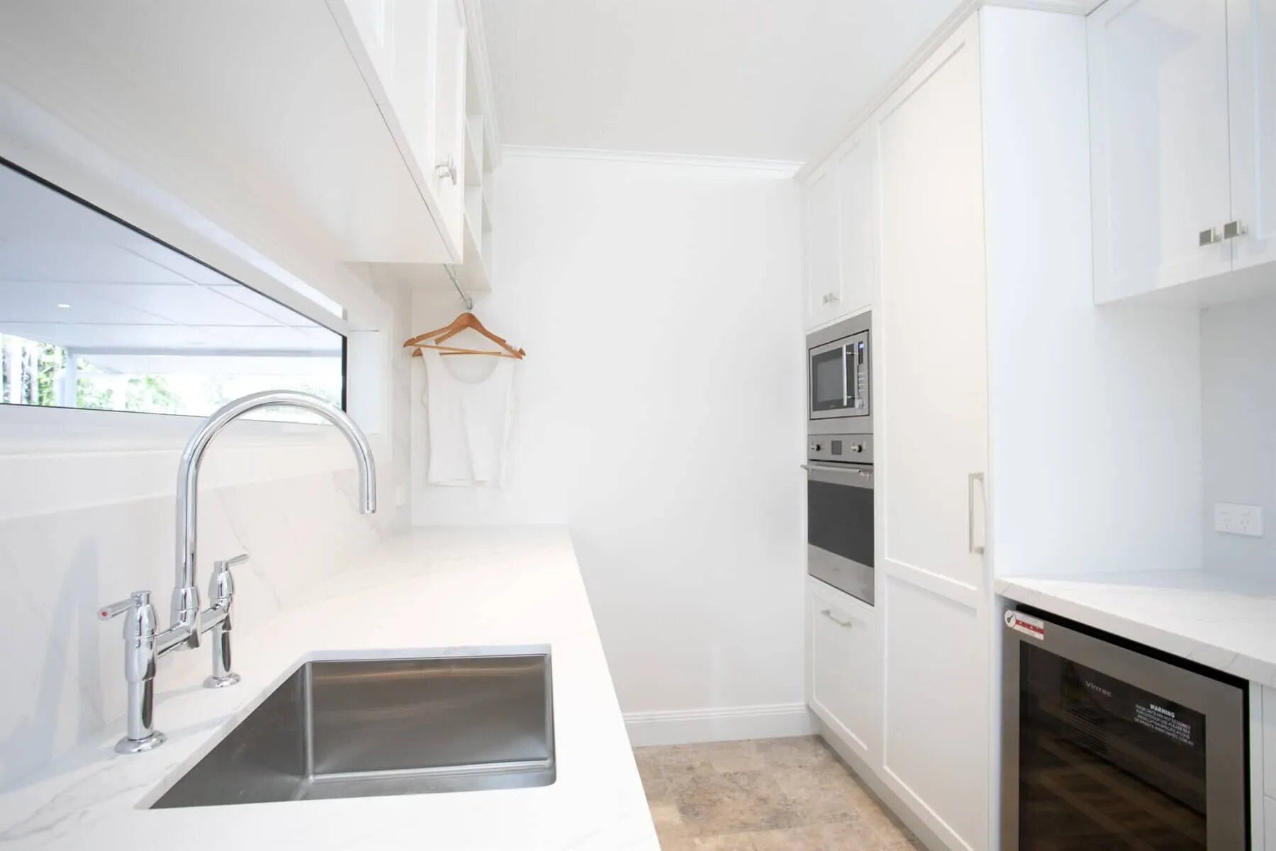A Kitchen with White Cabinets and A Stainless Steel Sink — Custom Cabinets Design in Berrimah, NT
