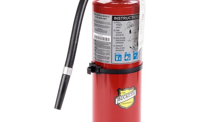 A red Pickett fire extinguisher with a black hose and instruction label on a white background.