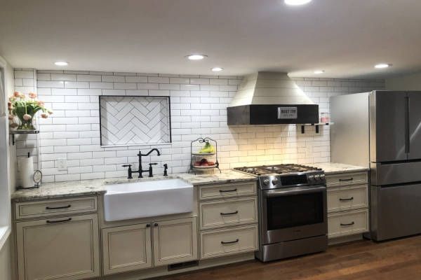 A Kitchen with Appliances and Wooden Floor