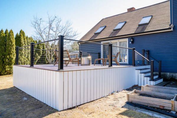 Blue House with Wooden Deck