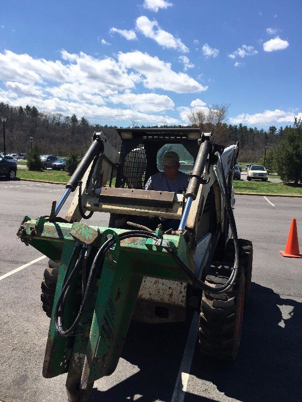 Josh Controlling Vehicle — Horseshoe, NC — Carolina Concrete Designs Inc