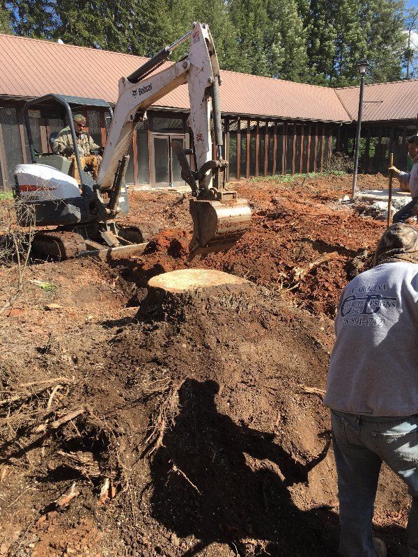Men Using Excavator — Horseshoe, NC — Carolina Concrete Designs Inc