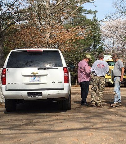 Men Near Vehicle In A Meeting  — Horseshoe, NC — Carolina Concrete Designs Inc
