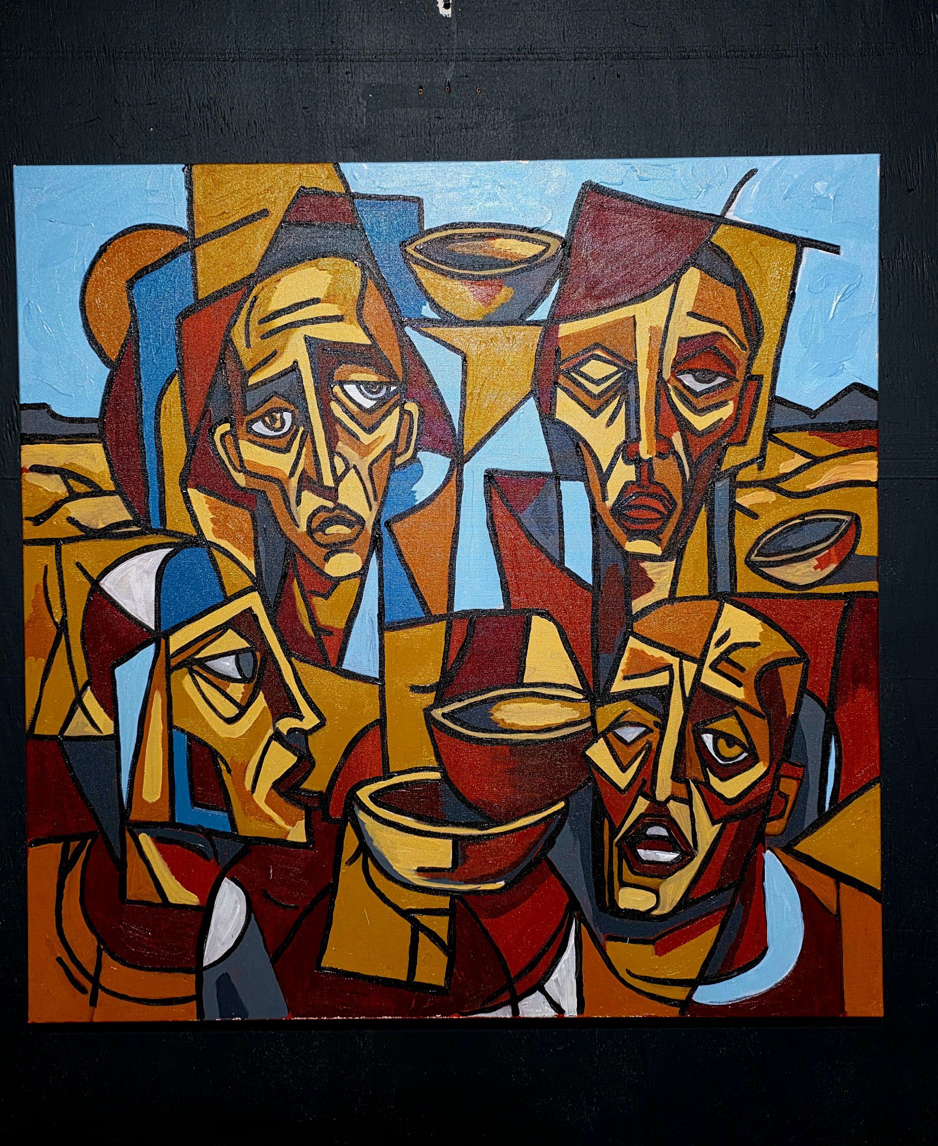 Abstract cubist painting of three expressive faces in warm reds, golds, and browns against a blue background