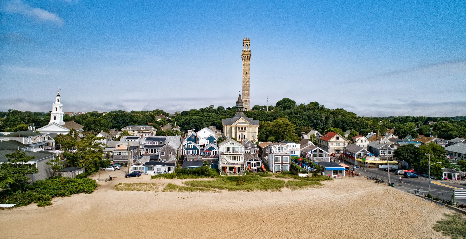 An aerial view of a small town with a tower in the middle of it.