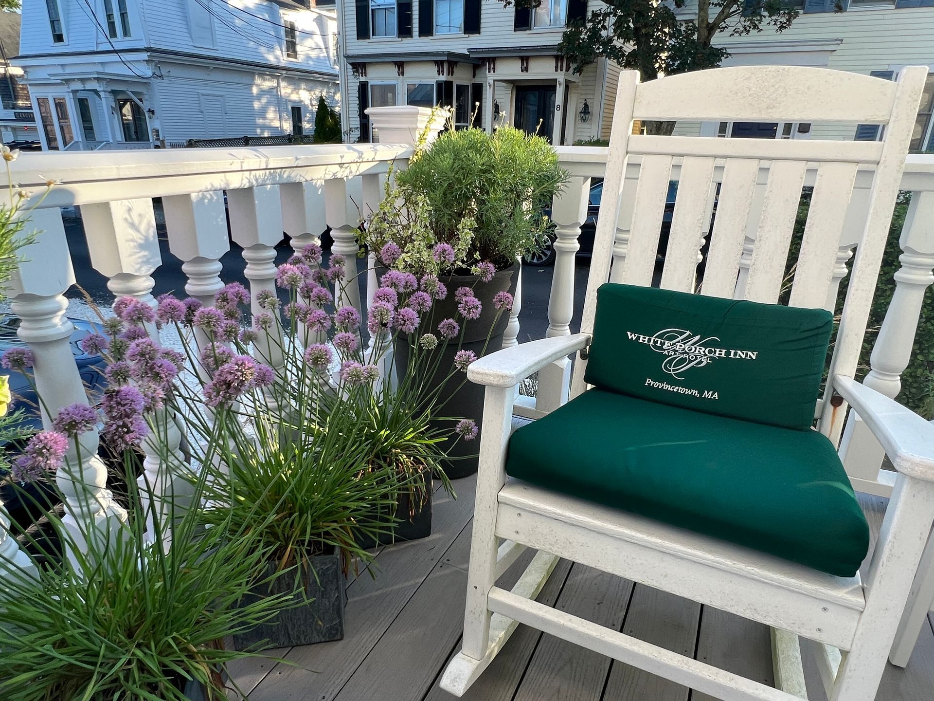 rocking chair and flowers on the porch.