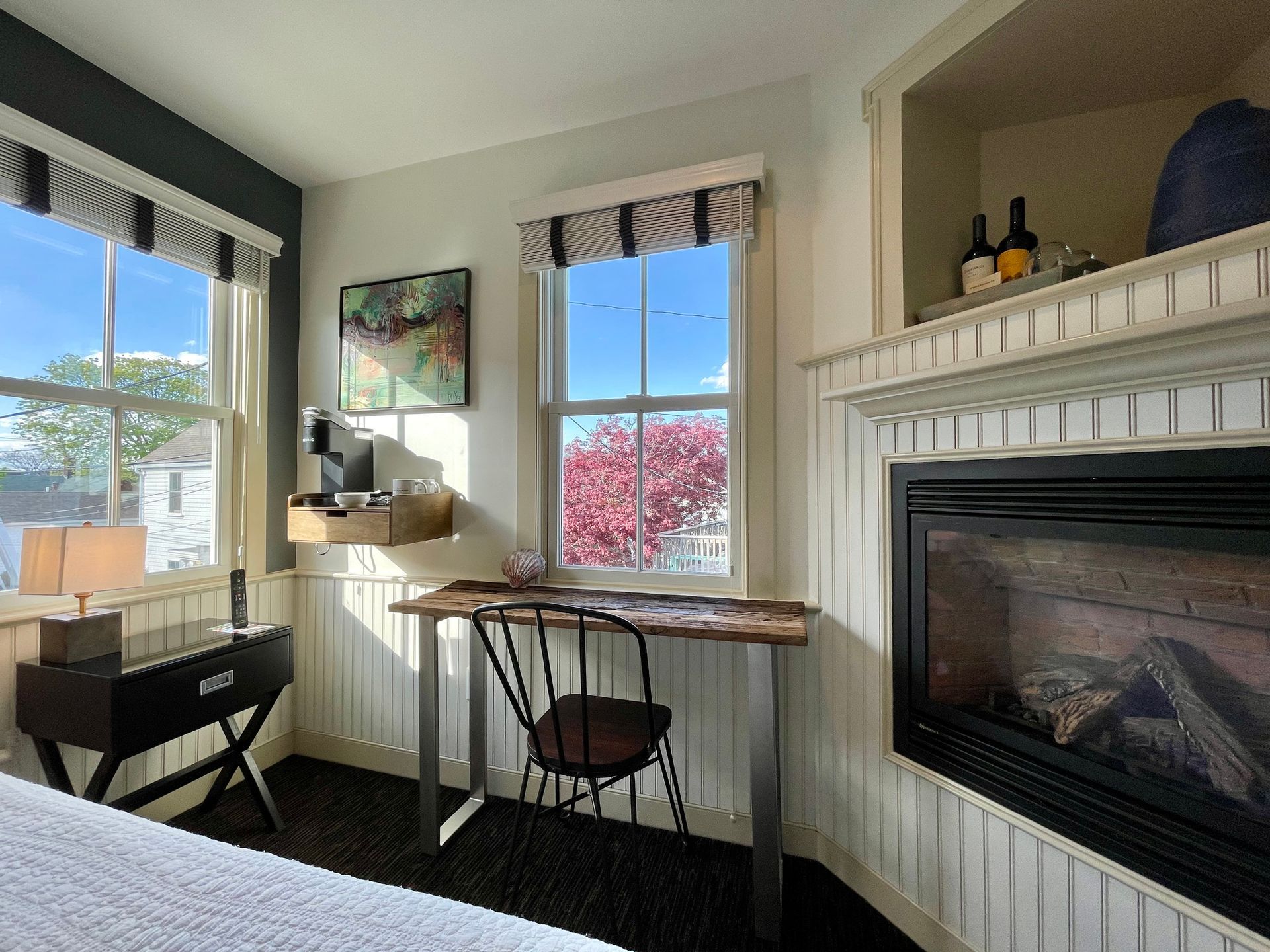 Interior picture:  Nauset Light King guest room with bed, writing desk, fireplace, and great lighting.