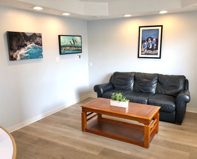A living room with a couch and a coffee table