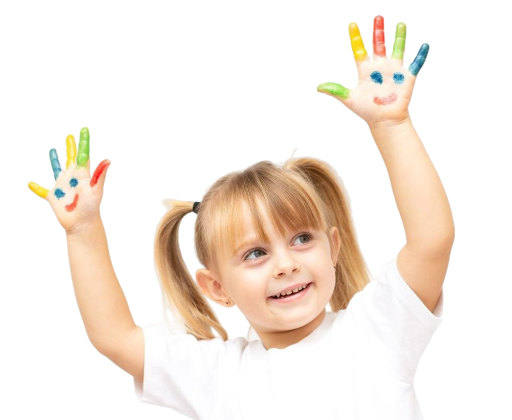Smiling child with hands on cheeks wearing a yellow sweater.