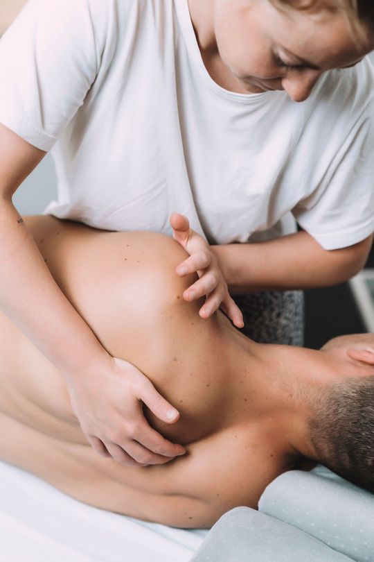 Massaging Patient's Shoulder — Little Falls, NJ — Health on Main