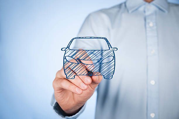 Person drawing car sketch showcasing auto insurance concept with focus on potential damage.