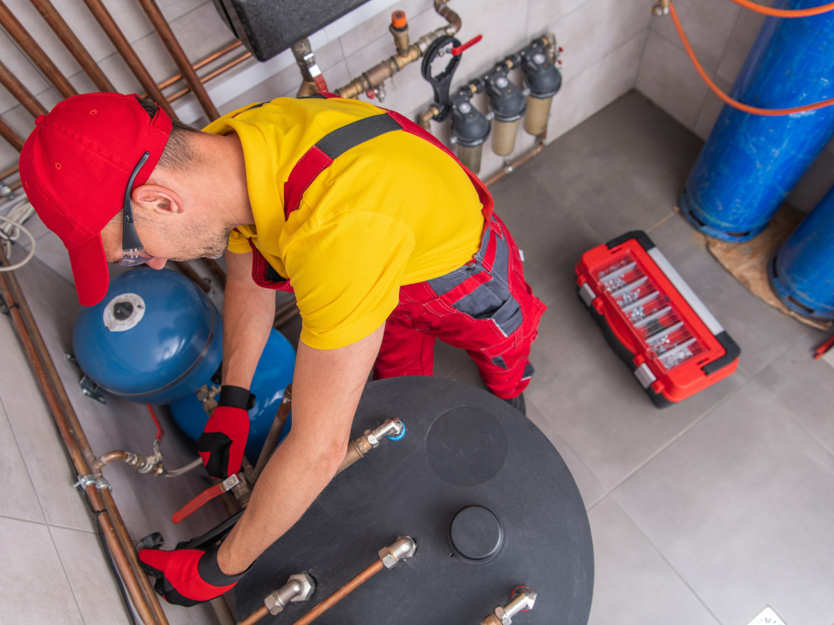 a photo of a plumber check the hot water heater