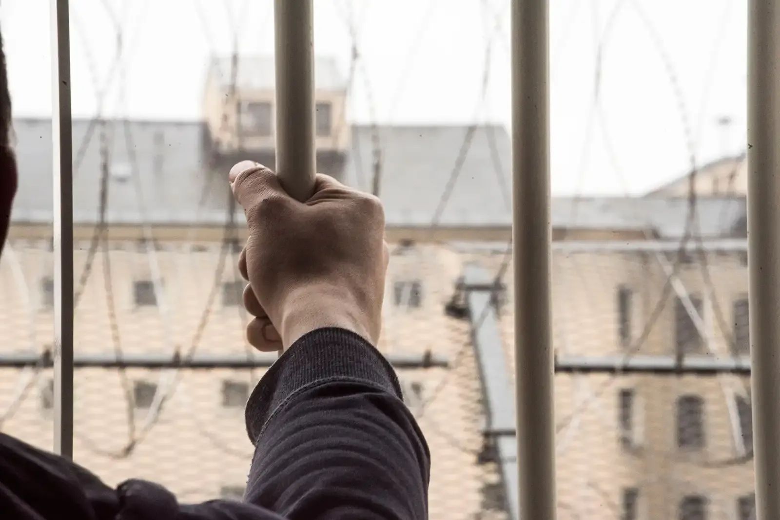 A man behind a jail bars