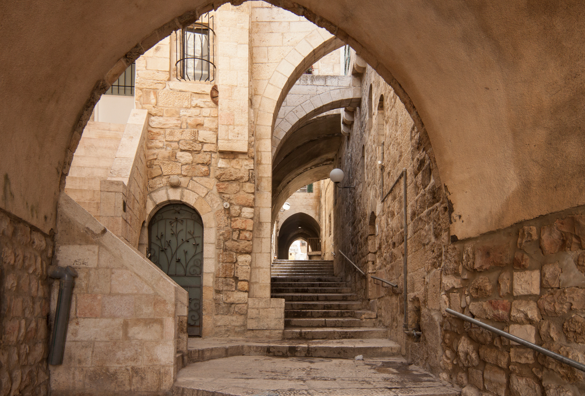 A stone archway with stairs leading up to it