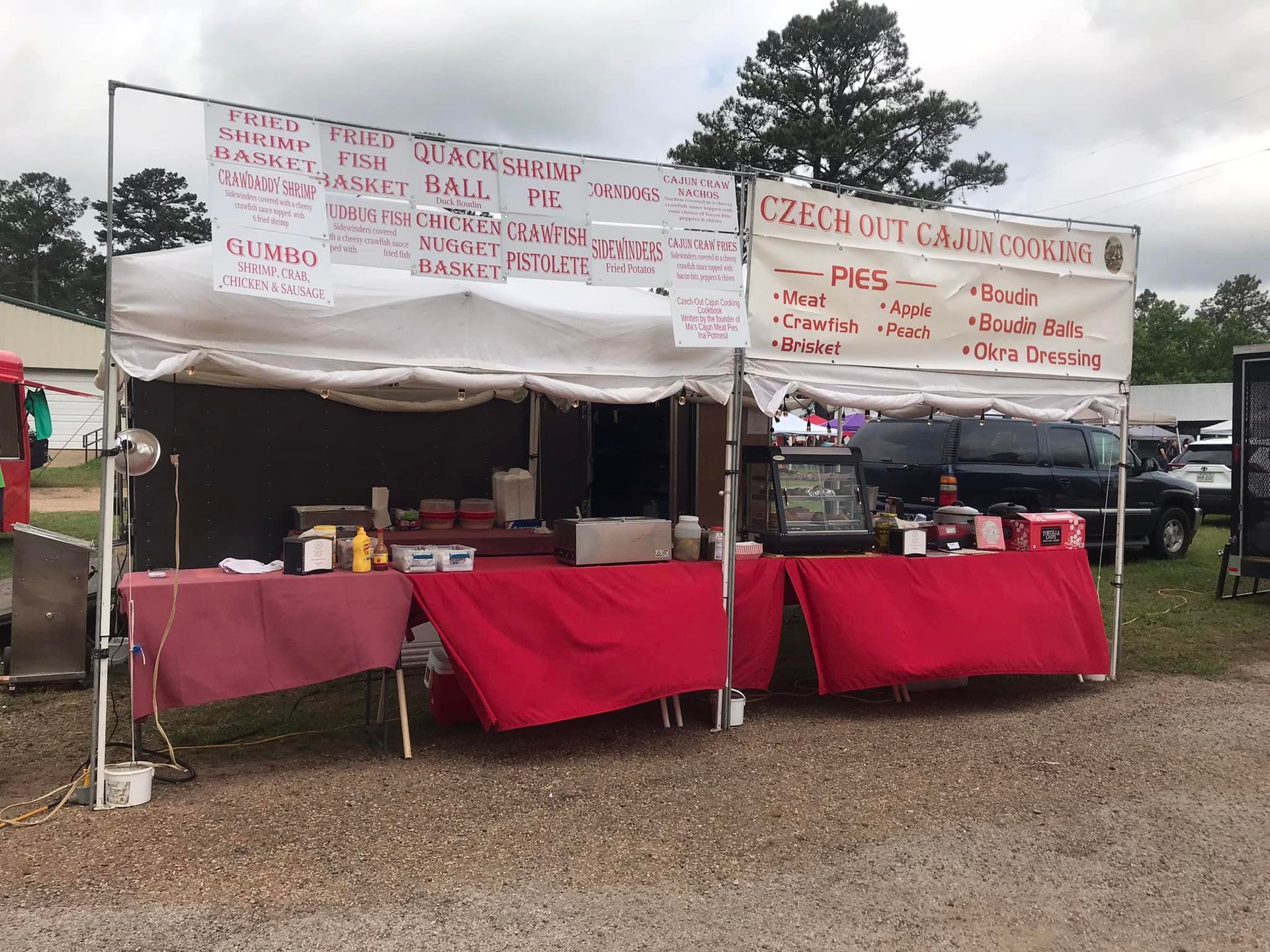 Crawfish empanada for sale, $4.00, with a green sign against a wood background.