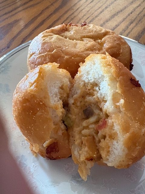 A table with bowls of fruit, yogurt, and snacks, decorated with beads.