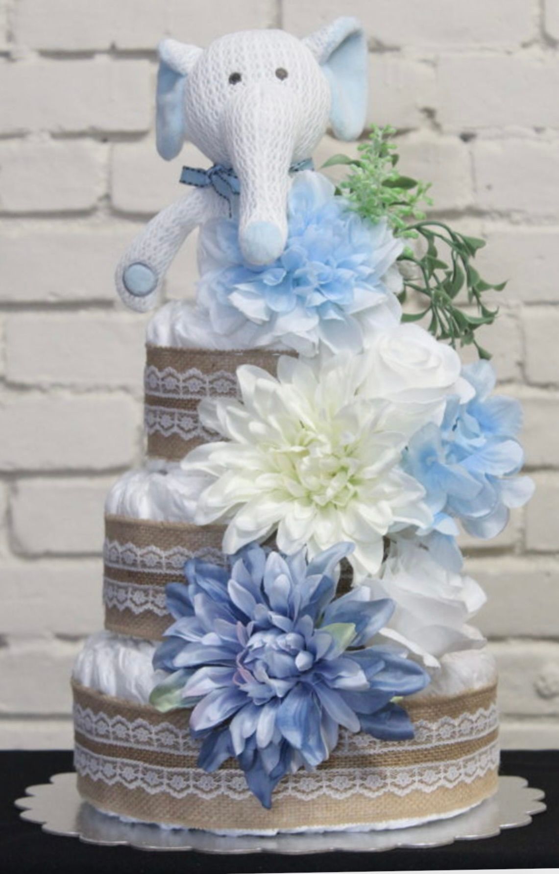 Three-tiered baby diaper cake decorated
