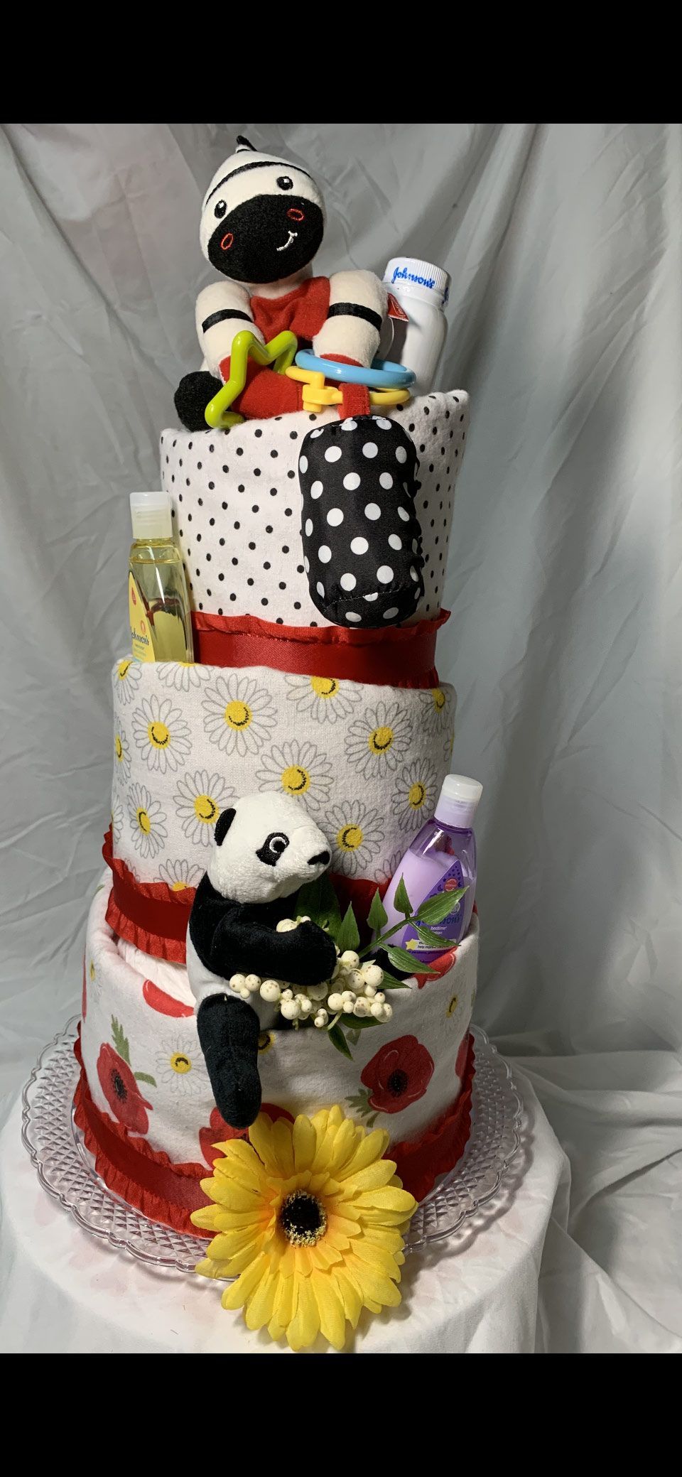 Multi-tiered diaper cake decorated with animal figures