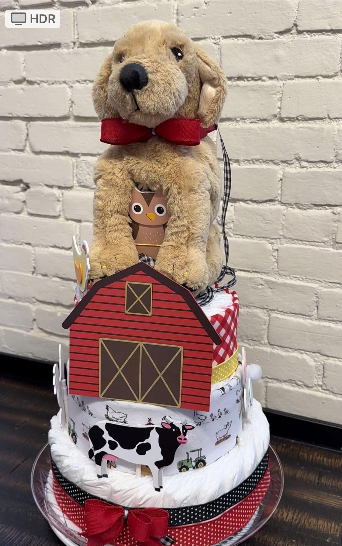 Dog-topped farm-themed diaper cake with barn