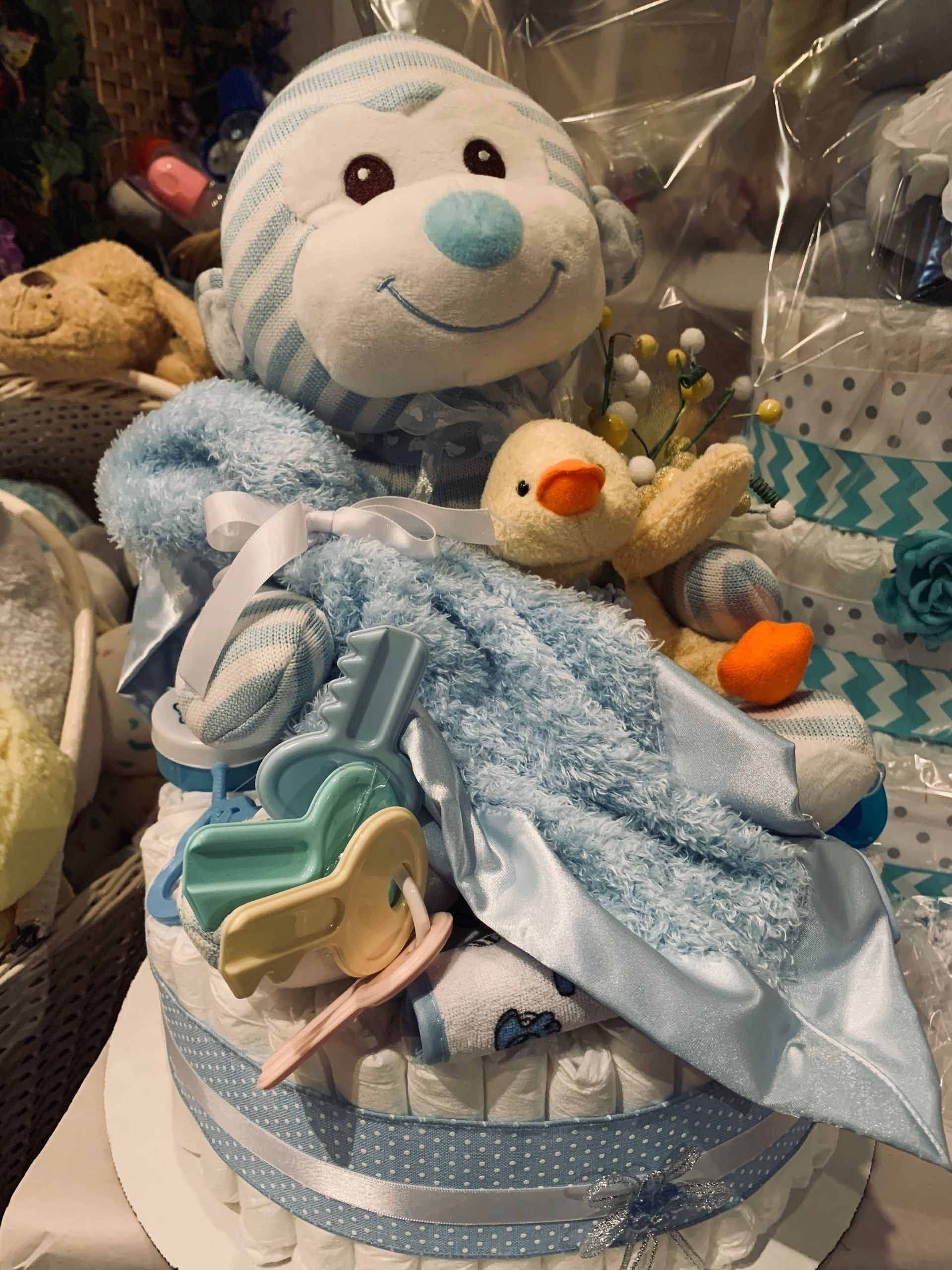 Diaper cake with blue and white decorations