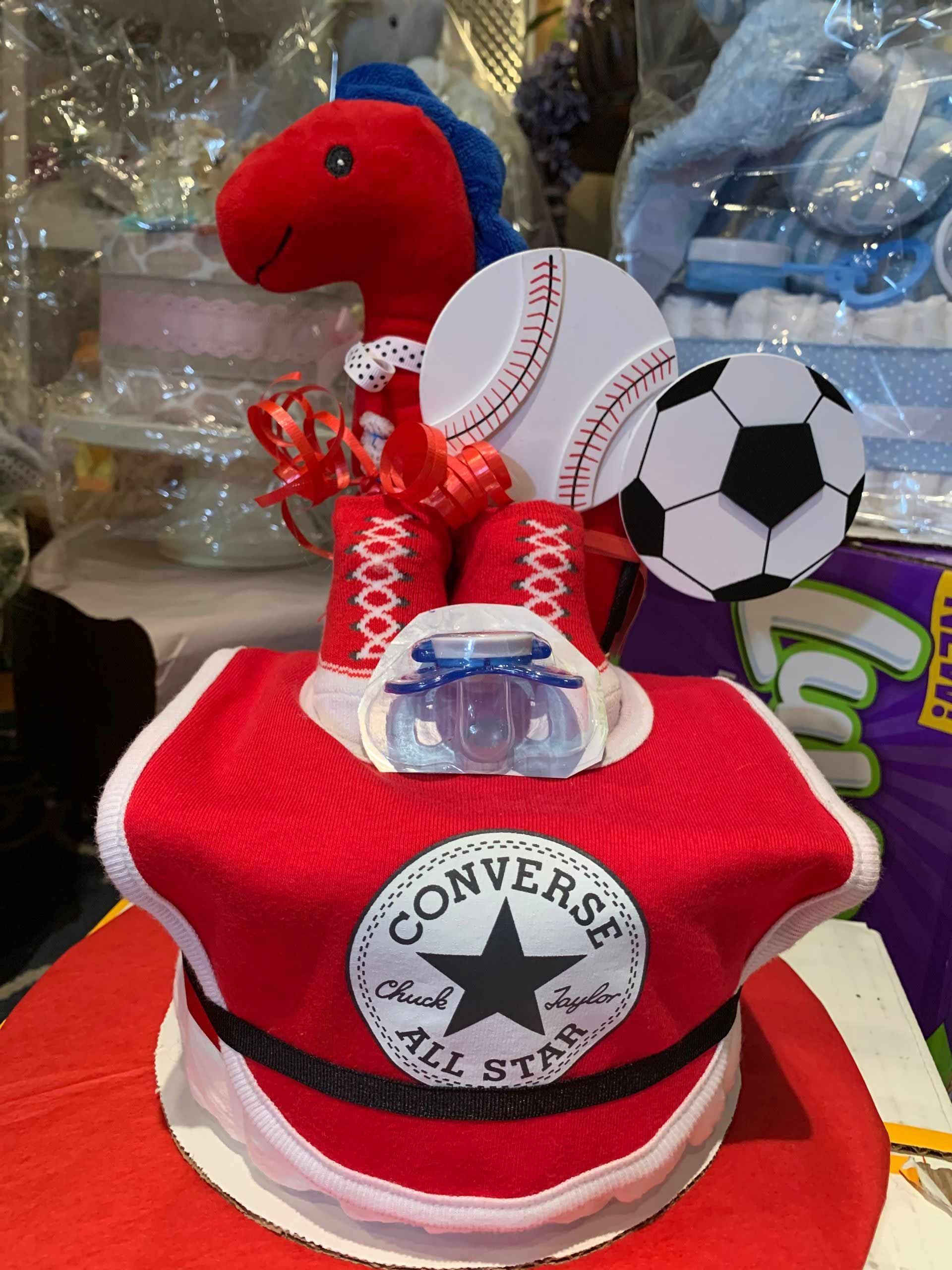 Diaper cake shaped as a red Converse shoe
