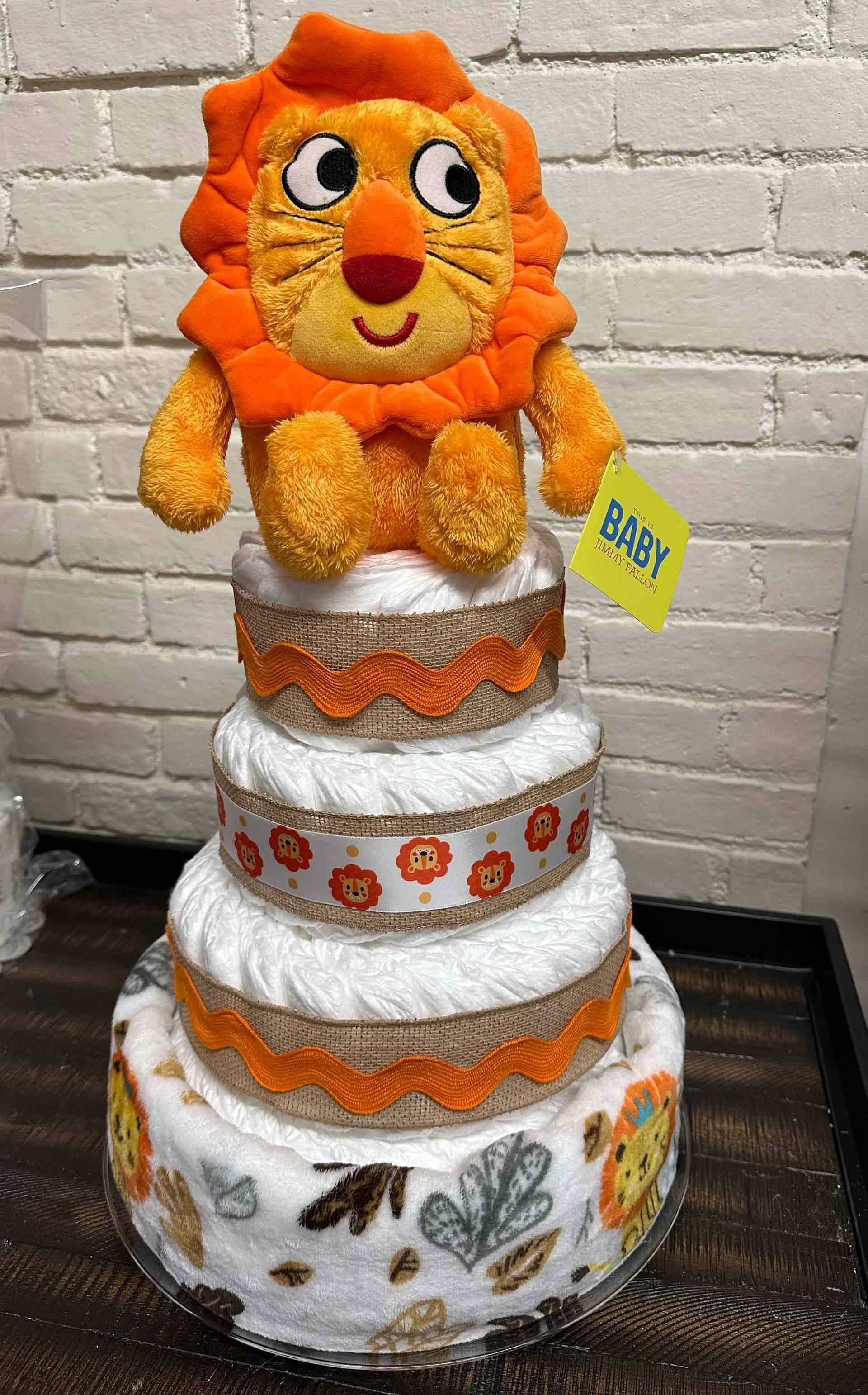 Diaper cake with a plush lion topper