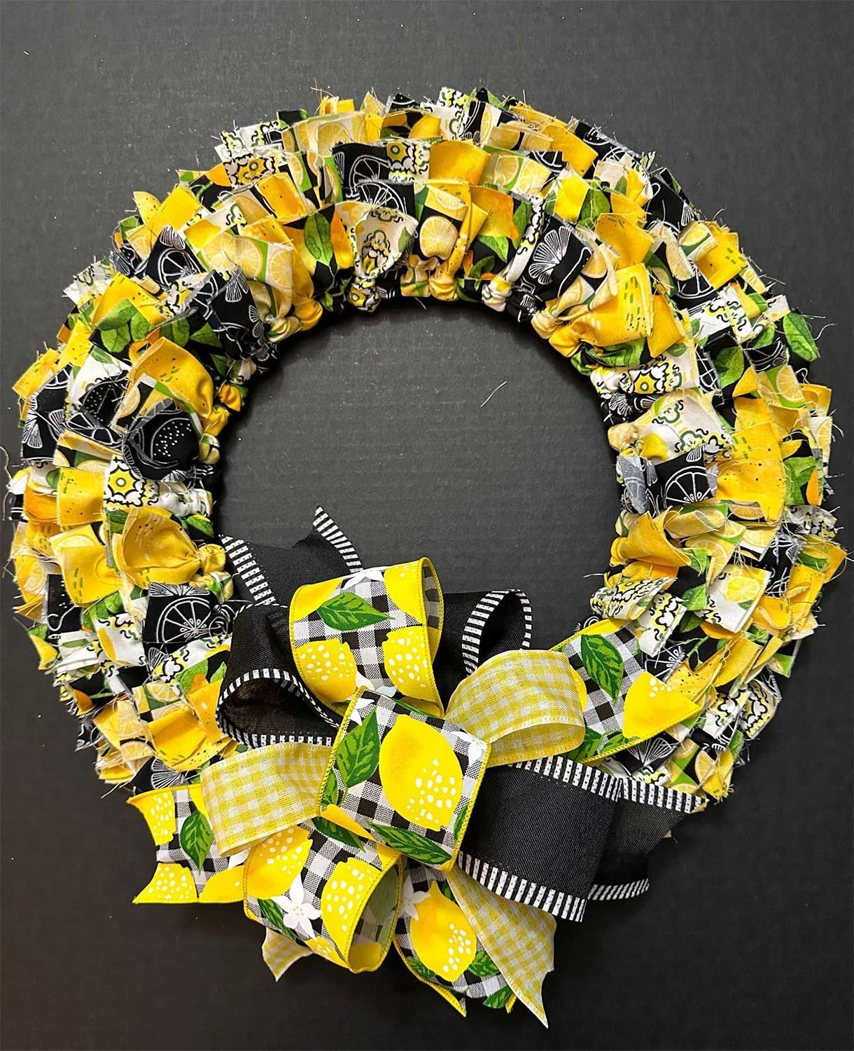 Lemon-themed fabric wreath with a bow