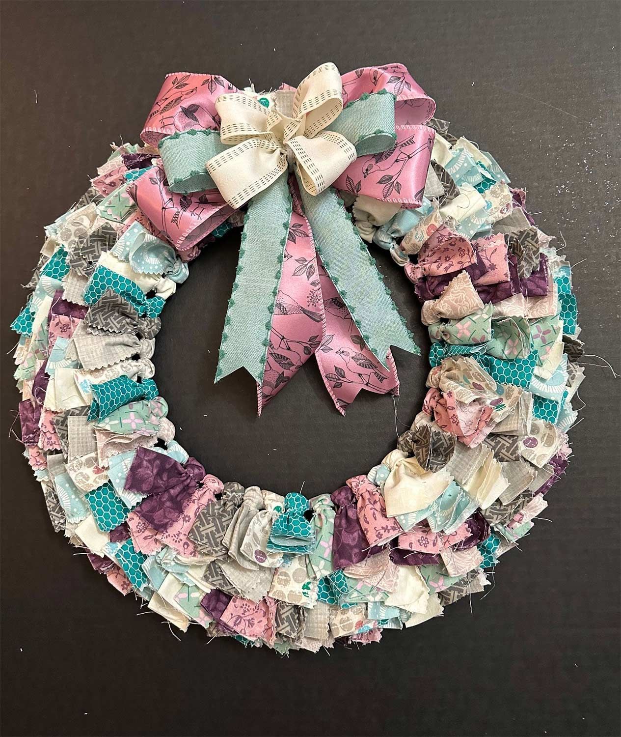 Fabric wreath with a large bow in different shades