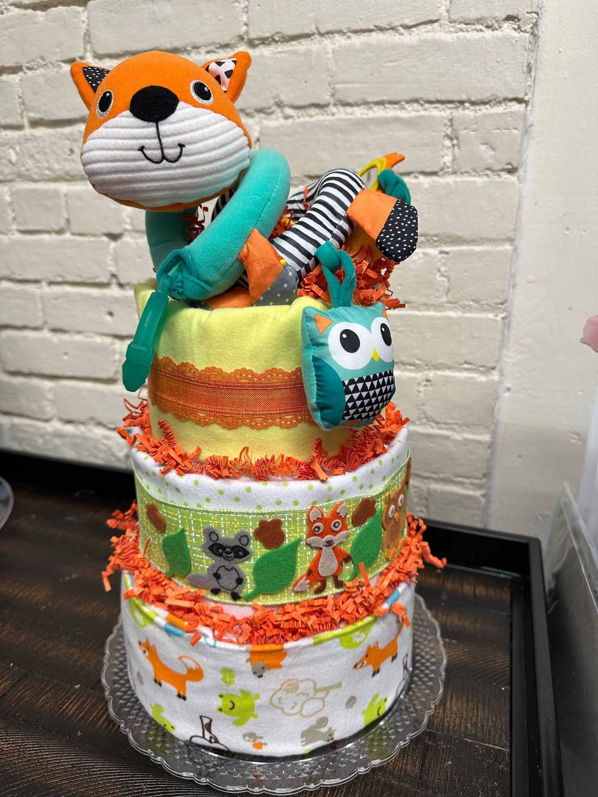 Three-tiered diaper cake decorated with fox