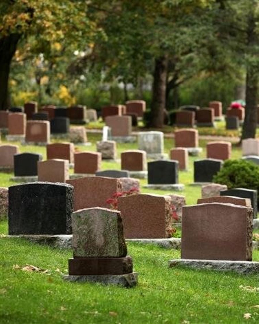 A large brick house with a tower on top of it