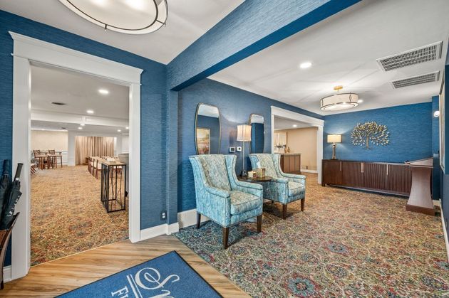 Senior couple looking over burial options at HIllside