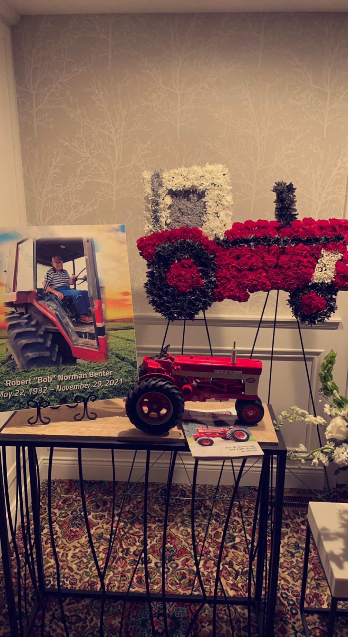 A large white house with a handicapped parking spot in front of it.