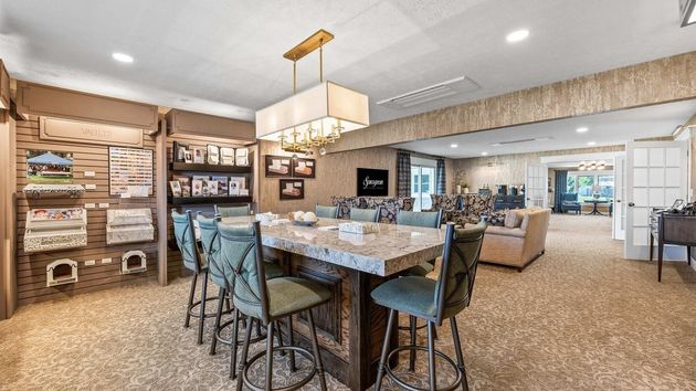 Staff Member shaking hands greeting couple at Hillside