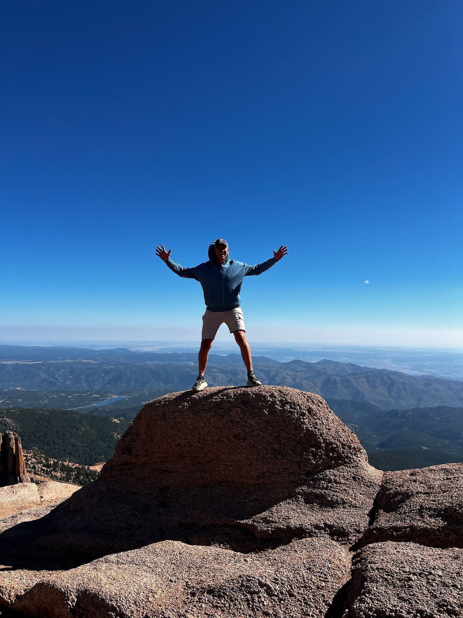 Coach David Berger on top of a mountain in Colorado