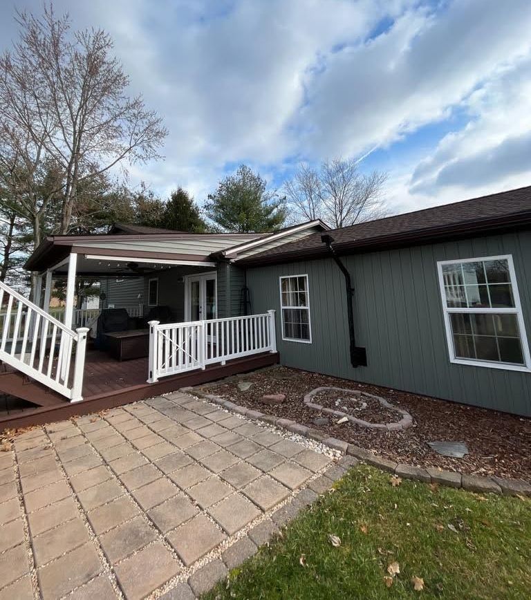 A house with a porch and stairs leading up to it
