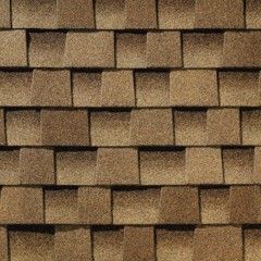 A close up of a roof made of wooden shingles.