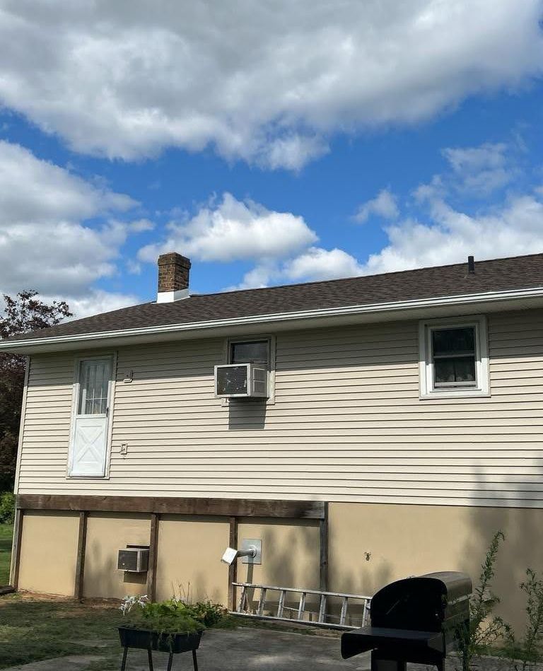 A house with a new barkwood colored roof.