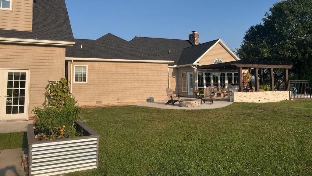 A large house with a large lawn in front of it