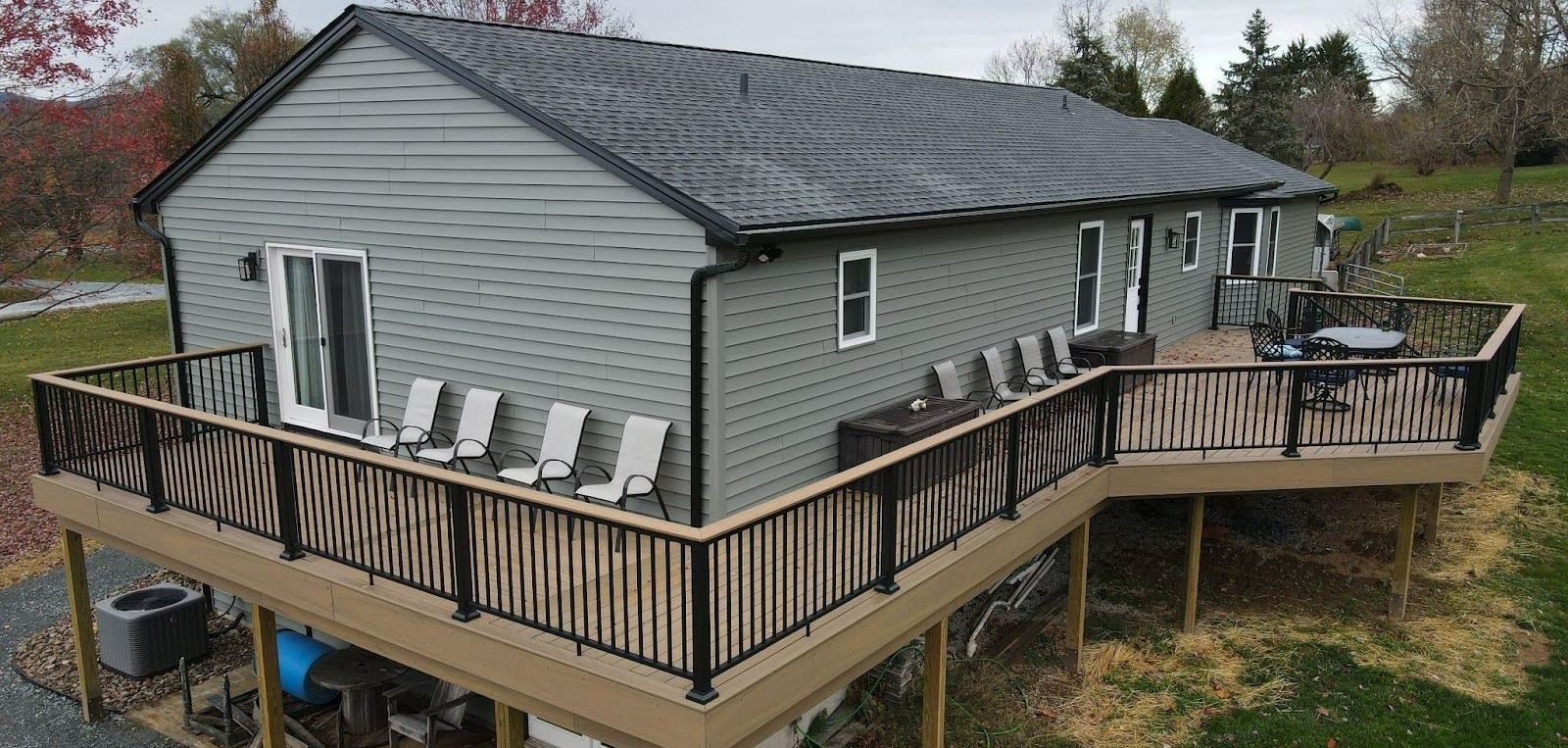 An aerial view of a house with a large deck.