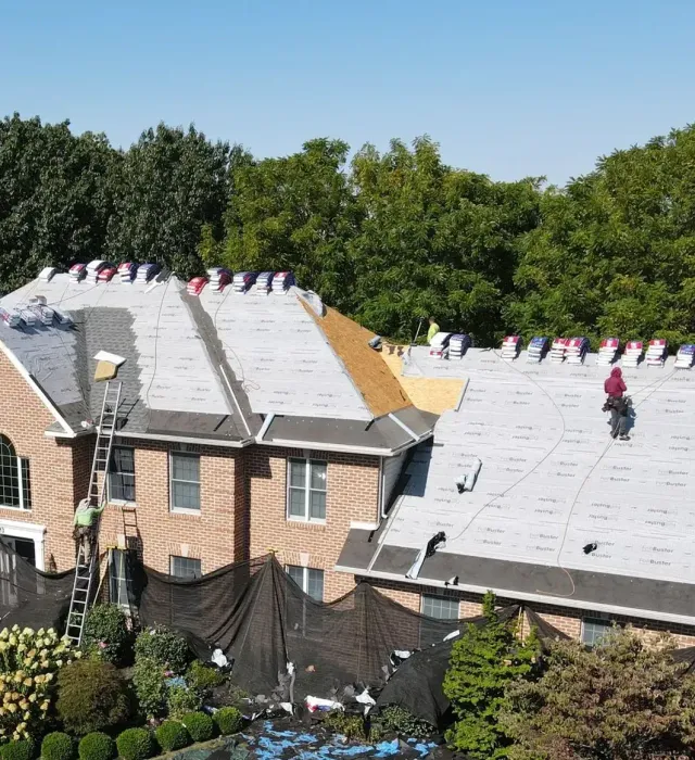A large house having their roof replaced by Dayhoff Construction.